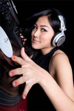 dj turntable - A female DJ mixing on a pair of turntables Stock Photo - Budget Royalty-Free & Subscription, Code: 400-05887216