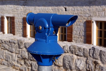 person focusing telescope - Blue telescope in Budva, Montenegro Stock Photo - Budget Royalty-Free & Subscription, Code: 400-05887298
