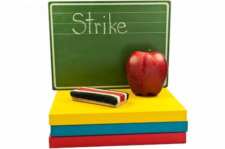Chalk board with STRIKE written on it.Apple and chalk brush also. This has a clipping path. Stock Photo - Budget Royalty-Free & Subscription, Code: 400-05887640