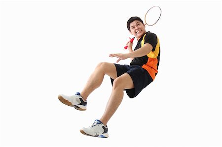 Young male badminton player in action.Isolated in plain background. Foto de stock - Super Valor sin royalties y Suscripción, Código: 400-05887642