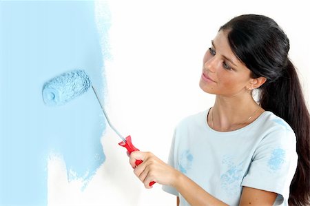 simsearch:400-05700794,k - roller in woman hand paint on the wall Stock Photo - Budget Royalty-Free & Subscription, Code: 400-05887927