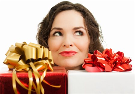 simsearch:400-05156727,k - Beautiful young woman peeking over beautifully wrapped Christmas gifts and looking at copyspace Foto de stock - Super Valor sin royalties y Suscripción, Código: 400-05887934