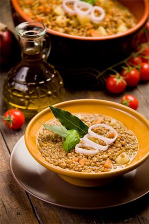 fresh homemade lentils soup with onions and cherry tomatoes on wooden table Stockbilder - Microstock & Abonnement, Bildnummer: 400-05888048