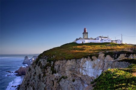 sunset west coast blue sky - Dramatic view of cliffs and lighthouse on Cabo da Roca cape in Portugal on sunrise Stock Photo - Budget Royalty-Free & Subscription, Code: 400-05888219