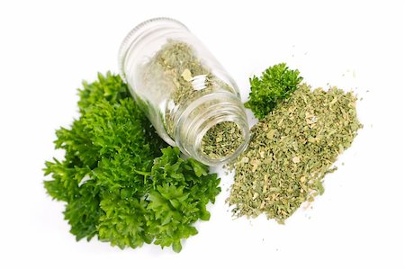 scattered spices - Glass bottle with parsley on white background Stock Photo - Budget Royalty-Free & Subscription, Code: 400-05888757