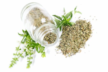 scattered spices - Glass bottle with basil on white background Stock Photo - Budget Royalty-Free & Subscription, Code: 400-05888779