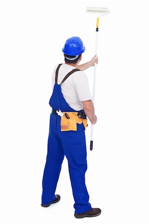 Handyman worker painting the wall with roller brush - isolated with a bit of shadow Stock Photo - Budget Royalty-Free & Subscription, Code: 400-05888794