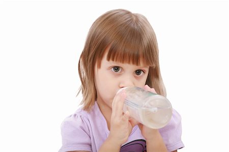 Little girl drinking water of her bottle. White background Stock Photo - Budget Royalty-Free & Subscription, Code: 400-05889074