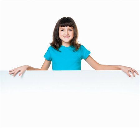 simsearch:400-04340435,k - cute child behind a board over white background Stock Photo - Budget Royalty-Free & Subscription, Code: 400-05880805