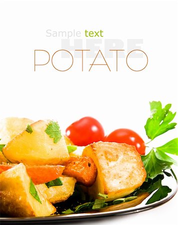 scrub country - Roasted potatoes with herbs over white background Stock Photo - Budget Royalty-Free & Subscription, Code: 400-05880923