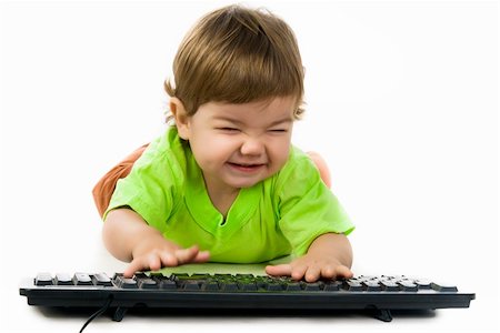 simsearch:400-04129482,k - Little child holding keyboard over white background Photographie de stock - Aubaine LD & Abonnement, Code: 400-05880930