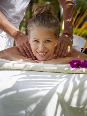 resort outdoor bed - Young beautiful blonde caucasian woman gets massage and beauty treatment in luxury resort Photographie de stock - Aubaine LD & Abonnement, Code: 400-05881031