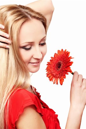 simsearch:400-04129614,k - Closeup portrait of female model holding red gerbera on white background Stock Photo - Budget Royalty-Free & Subscription, Code: 400-05881165
