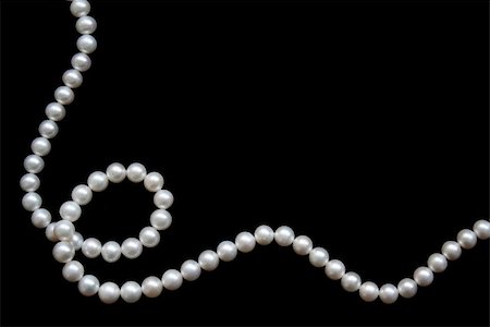 shiny jewelery - White pearls on the black velvet background Stock Photo - Budget Royalty-Free & Subscription, Code: 400-05881447