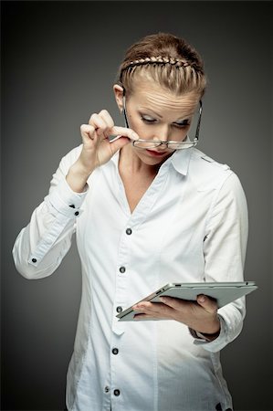 surprised adult work casual - Young business woman exploring tablet computer Stock Photo - Budget Royalty-Free & Subscription, Code: 400-05881472