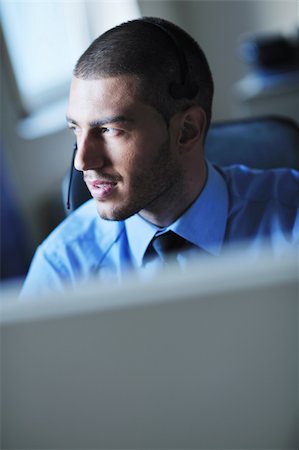 simsearch:400-06108986,k - businessman with a headset portrait at bright call center helpdesk support office Stock Photo - Budget Royalty-Free & Subscription, Code: 400-05881515