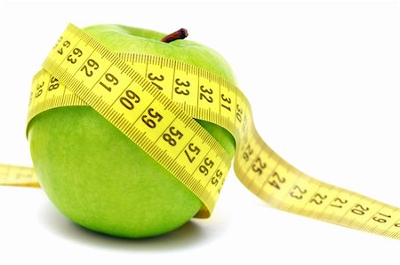 Green apple and measuring tape isolated on white background Photographie de stock - Aubaine LD & Abonnement, Code: 400-05882066