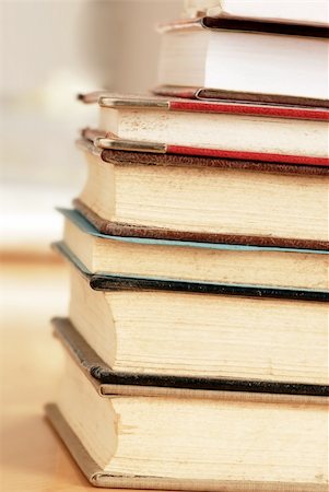 old dusty closed books stack on table Stock Photo - Budget Royalty-Free & Subscription, Code: 400-05882102