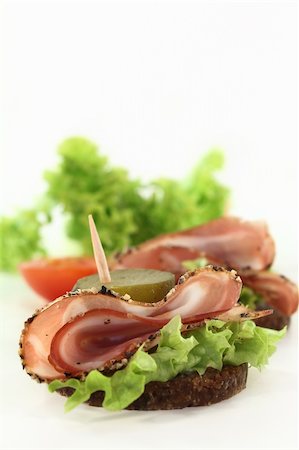 silencefoto (artist) - Canapes with smoked bacon and sour cucumber Stockbilder - Microstock & Abonnement, Bildnummer: 400-05882292