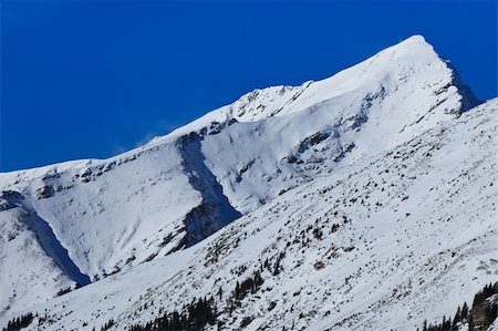 simsearch:400-07298343,k - winter mountain landscape with a blue sky, Fagaras Mountains, Romania Fotografie stock - Microstock e Abbonamento, Codice: 400-05882379
