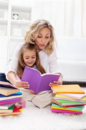 simsearch:400-05749645,k - Reading a book with mom - little girl first spelling exercises Stock Photo - Budget Royalty-Free & Subscription, Code: 400-05882476