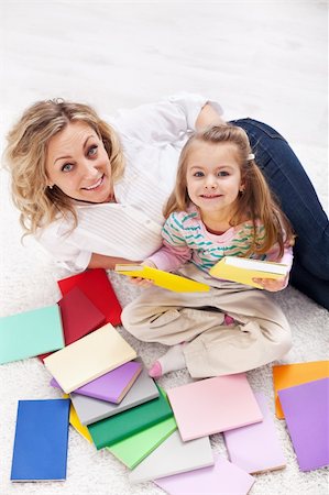simsearch:400-05749645,k - Discovering the world of books - little girl and woman laying on the floor Stock Photo - Budget Royalty-Free & Subscription, Code: 400-05882477
