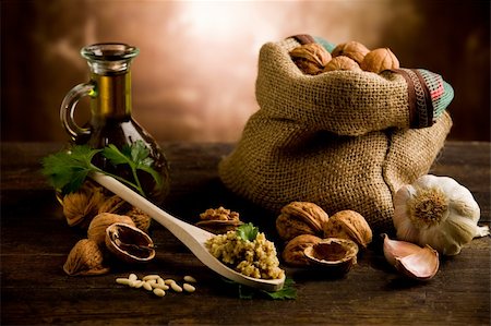 photo of delicious fresh ingredients for walnut pesto on wooden table Foto de stock - Super Valor sin royalties y Suscripción, Código: 400-05882645