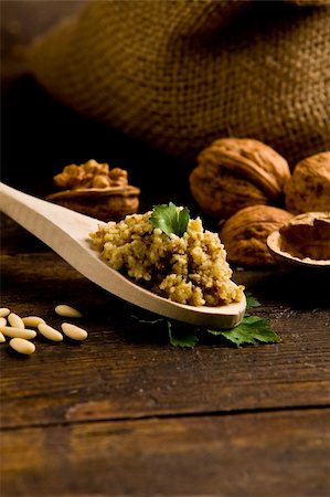 pesto on a spoon - photo of delicious fresh ingredients for walnut pesto on wooden table Stock Photo - Budget Royalty-Free & Subscription, Code: 400-05882646