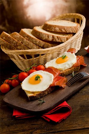 conceptual photo of english breakfast with fried eggs and bacon on wooden table Stock Photo - Budget Royalty-Free & Subscription, Code: 400-05882655