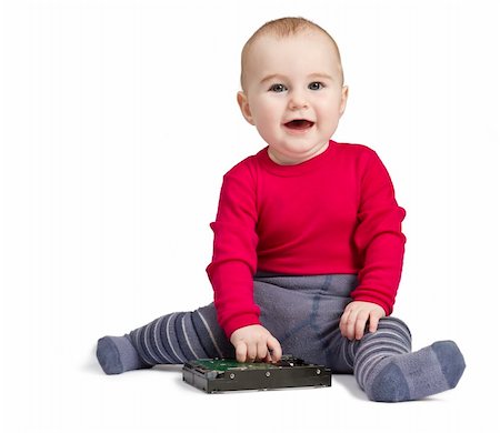 young child in white background with hard drive. red shirt and blue trousers Photographie de stock - Aubaine LD & Abonnement, Code: 400-05882715