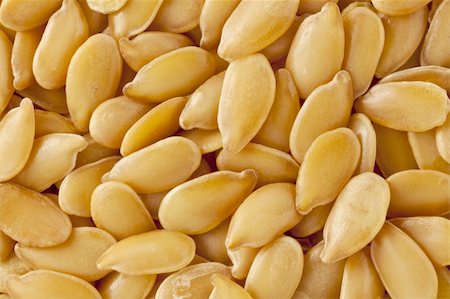 simsearch:400-06556120,k - background of golden flax  seeds, two times life-size magnification Fotografie stock - Microstock e Abbonamento, Codice: 400-05882860