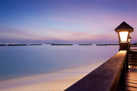 simsearch:400-06064328,k - Night sky at a seaside beach resort with sun setting, long exposure Stockbilder - Microstock & Abonnement, Bildnummer: 400-05882882