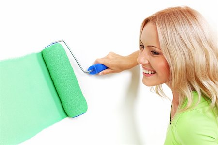 woman paints the wall brush Stock Photo - Budget Royalty-Free & Subscription, Code: 400-05882899