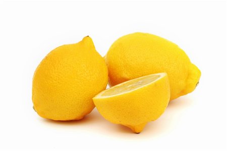 simsearch:400-05057164,k - yellow lemons slice pile isolated on white Fotografie stock - Microstock e Abbonamento, Codice: 400-05882937