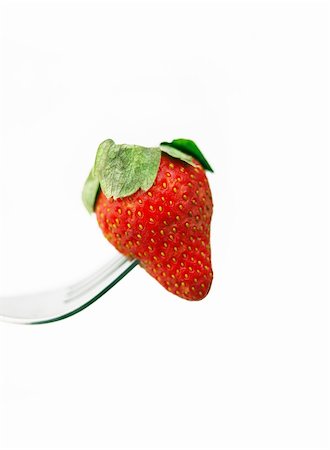 delicious food on fork white background - fresh strawberry on a fork over white Stock Photo - Budget Royalty-Free & Subscription, Code: 400-05883152