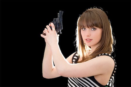 simsearch:400-05883228,k - Beautiful young woman with pistol. Isolated on black Foto de stock - Royalty-Free Super Valor e Assinatura, Número: 400-05883228