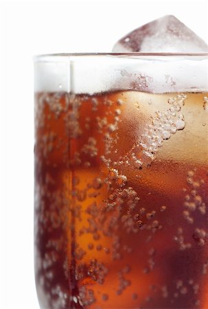 fizzy pop - Cold cola in a glass with ice cubes over white background Stock Photo - Budget Royalty-Free & Subscription, Code: 400-05883312