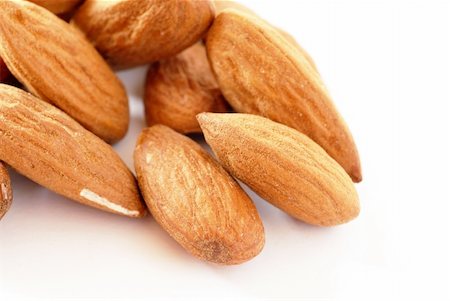 simsearch:400-07210943,k - brown raw almonds over white background macro Stock Photo - Budget Royalty-Free & Subscription, Code: 400-05883326