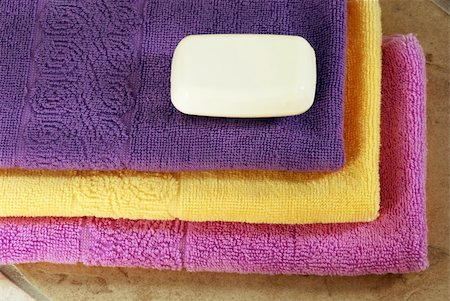 simsearch:400-04501066,k - pile of purple, yellow and magenta towels with white soap Stock Photo - Budget Royalty-Free & Subscription, Code: 400-05883383