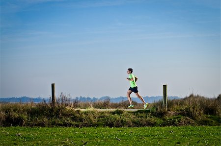 desert runners photography - Male runner at sprinting speed training for marathon outdoors on country landscape. Stock Photo - Budget Royalty-Free & Subscription, Code: 400-05883523