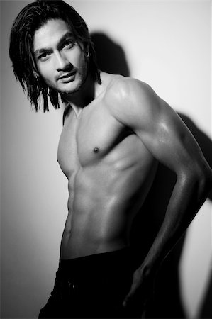 smart models male - Portrait shot of a shirtless attractive young Indian man with long hair posing with hand on hip. Stock Photo - Budget Royalty-Free & Subscription, Code: 400-05883530