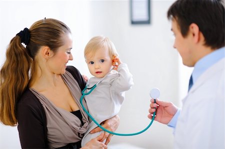 doctor and baby patient and mom - Cute baby on mamas hand playing with stethoscope Stock Photo - Budget Royalty-Free & Subscription, Code: 400-05883606