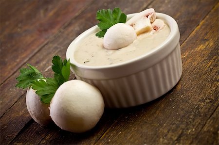 delicious homemade mushroom sauce on wooden table with parsley Stock Photo - Budget Royalty-Free & Subscription, Code: 400-05894504