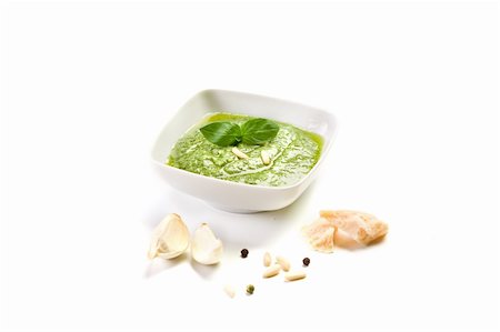 homemade pesto sauce on white background with garlic and parmesan Stockbilder - Microstock & Abonnement, Bildnummer: 400-05894503