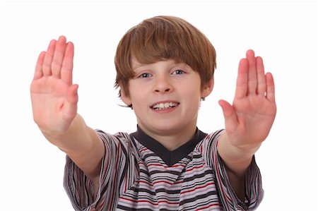 simsearch:400-04213571,k - Portrait of a young boy making stop gesture on white background Foto de stock - Royalty-Free Super Valor e Assinatura, Número: 400-05894539