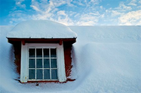 snow covered rooftops - Barn with an old window and snow-covered roof. Stock Photo - Budget Royalty-Free & Subscription, Code: 400-05894554