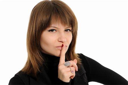 shushing girl - Young woman says ssshhh to maintain silence on a white background Stock Photo - Budget Royalty-Free & Subscription, Code: 400-05894722