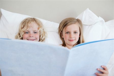simsearch:400-05751566,k - Brother and sister reading bedtime story together Stock Photo - Budget Royalty-Free & Subscription, Code: 400-05894968