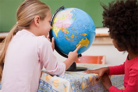 simsearch:6109-06196557,k - Little schoolgirls looking at a globe in a classroom Stock Photo - Budget Royalty-Free & Subscription, Code: 400-05895057