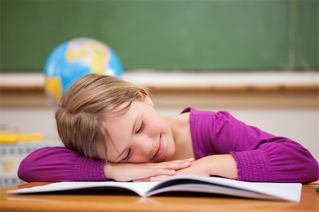 Schoolgirl sleeping on her desk in a classroom Stock Photo - Budget Royalty-Free & Subscription, Code: 400-05895410